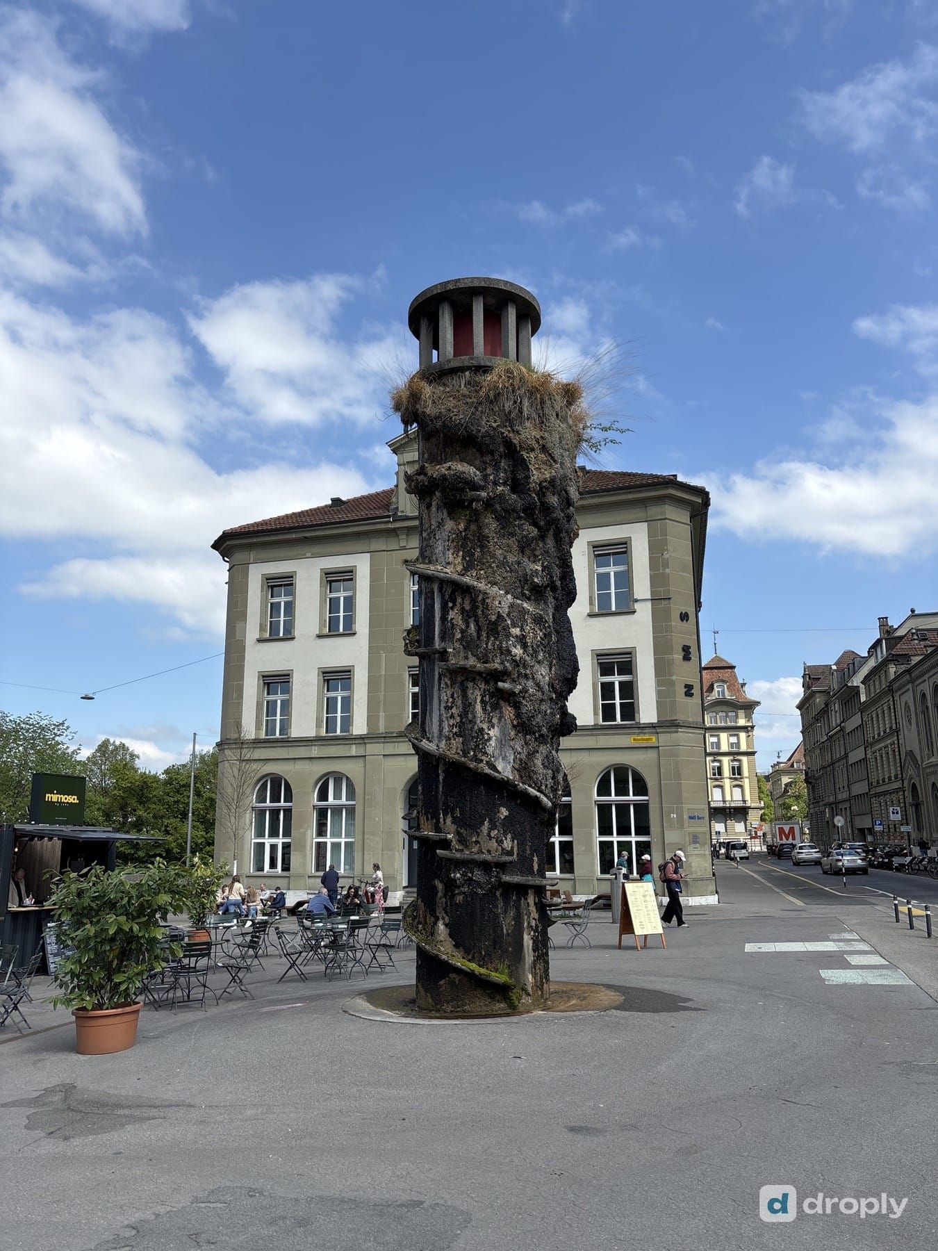 The Meret-Oppenheim-Brunnen on Waisenhausplatz in Bern, an overgrown concrete tower