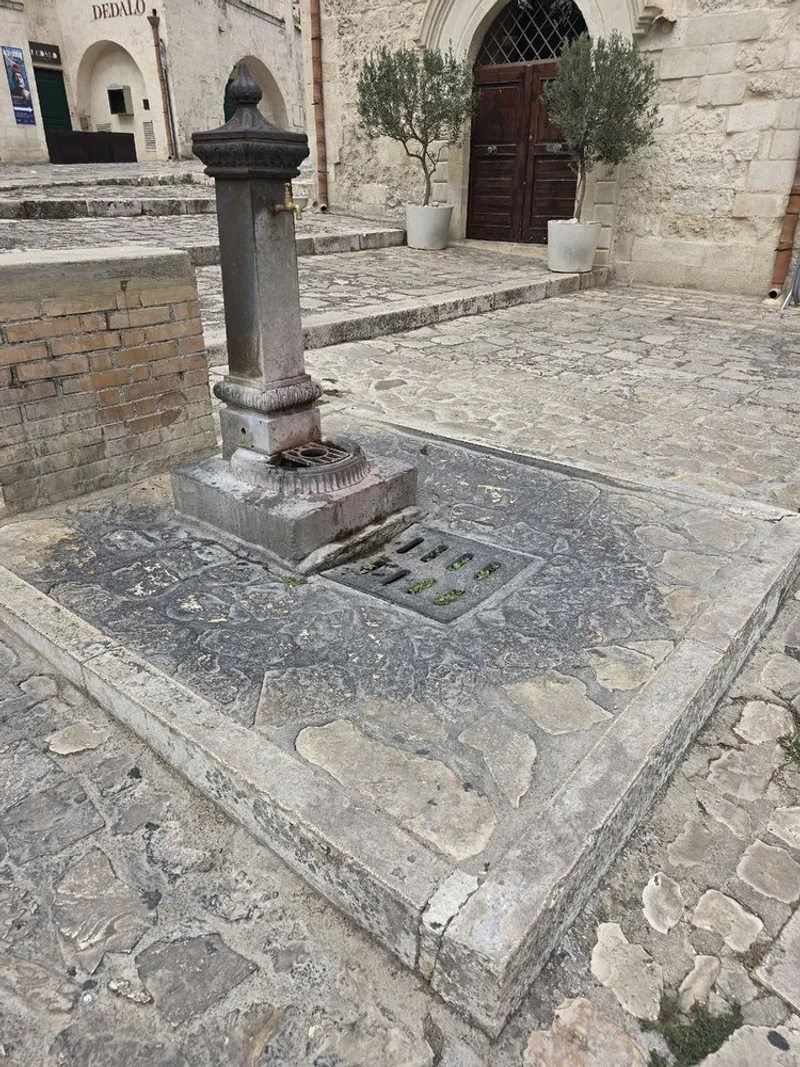 A street tap tucked into Matera's old town, good for a quick top up before the next set of stairs.
