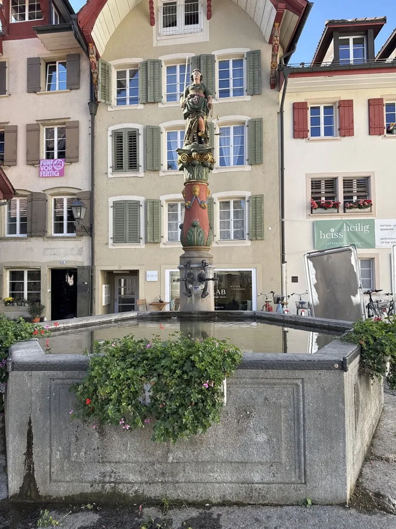 Top up on Kirchplatz before you keep wandering, this tap sits right at the base of the Gerechtigkeitsbrunnen, the…